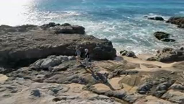 LAGUNA BEACH LOS CABOS BCS MEXICO-2023: Mother and Child on Rocky Coast