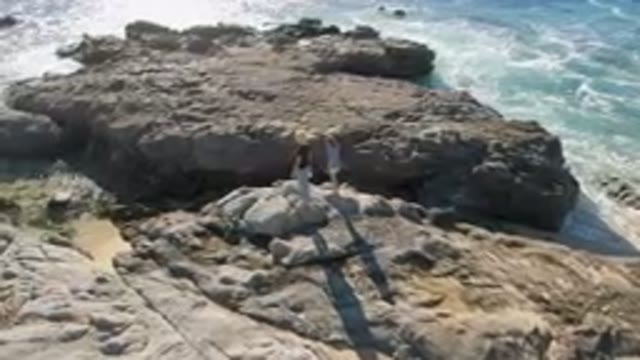 LAGUNA BEACH LOS CABOS BCS MEXICO-2023: Woman and Child Standing on Rocks