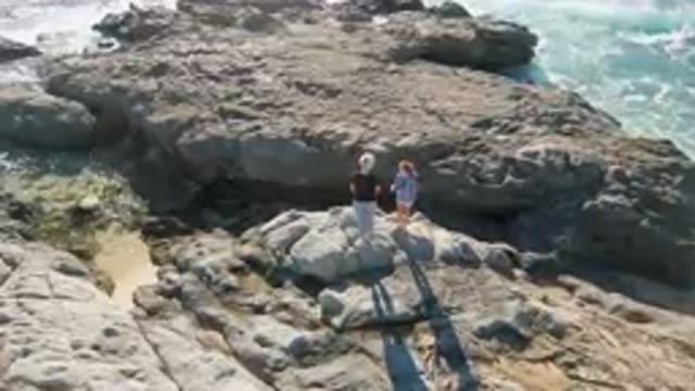 LAGUNA BEACH LOS CABOS BCS MEXICO-2023: Mother and Child on Rocky Coast