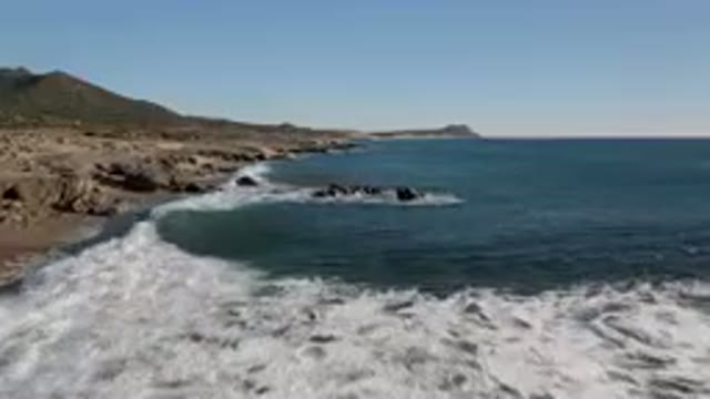 LAGUNA BEACH LOS CABOS BCS MEXICO-2023: Large Body Of Water With Rocks In The Foreground