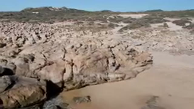 LAGUNA BEACH LOS CABOS BCS MEXICO-2023: People Exploring Rock Formations