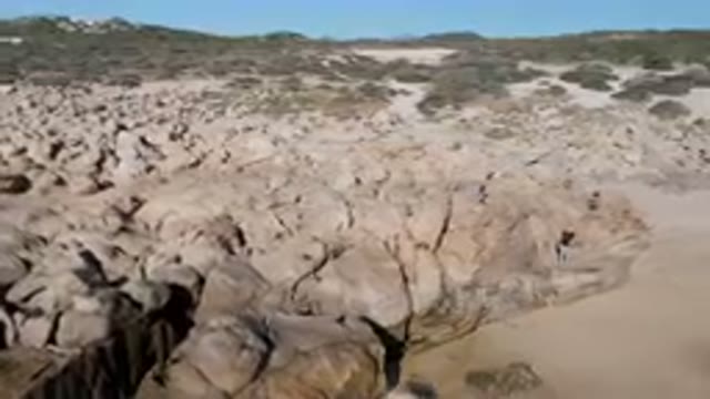 LAGUNA BEACH LOS CABOS BCS MEXICO-2023: People Explore a Coastal Rock Formation