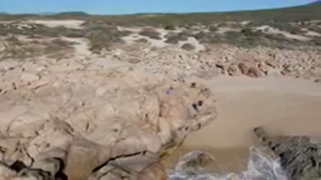 LAGUNA BEACH LOS CABOS BCS MEXICO-2023: People Standing On Rocks By The Ocean