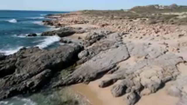 LAGUNA BEACH LOS CABOS BCS MEXICO-2023: Rocky Beach With a Few People Walking On
