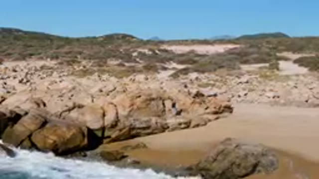 LAGUNA BEACH LOS CABOS BCS MEXICO-2023: Rocky Shoreline With Waves Crashing On