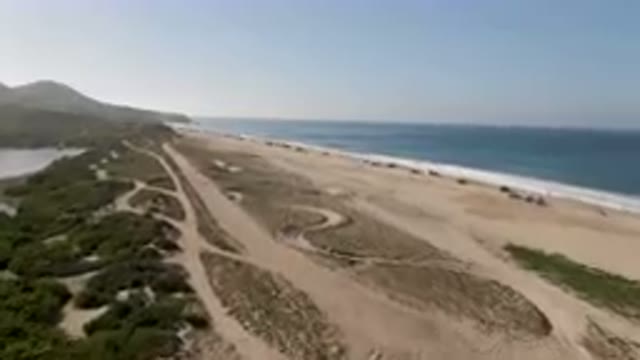 MIGRINO BCS MEXICO-2023: Beach With A Lot Of Sand And Water