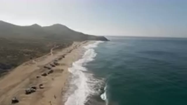 MIGRINO BCS MEXICO-2023: On The Beach With Cars Parked On The Sand