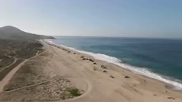 MIGRINO BCS MEXICO-2023: Beach With A Lot Of Cars Parked On It