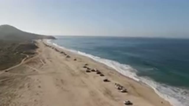 MIGRINO BCS MEXICO-2023: Vehicles Parked On A Beach Next To The Ocean