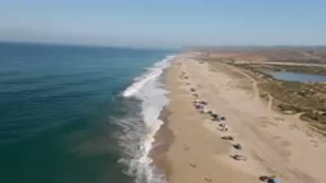 MIGRINO BCS MEXICO-2023: Arafly Beach With A Lot Of People On It