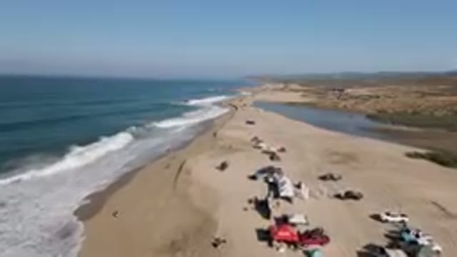MIGRINO BCS MEXICO-2023: Overview of People Camping on a Beach