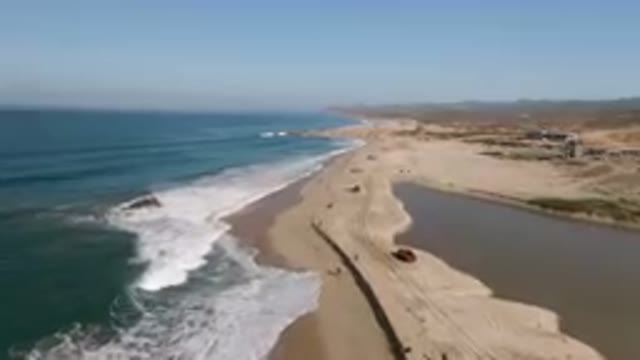 MIGRINO BCS MEXICO-2023: Truck Driving Down The Beach