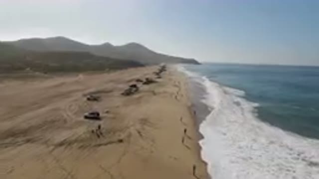 MIGRINO BCS MEXICO-2023: On The Beach With Cars Parked On The Sand