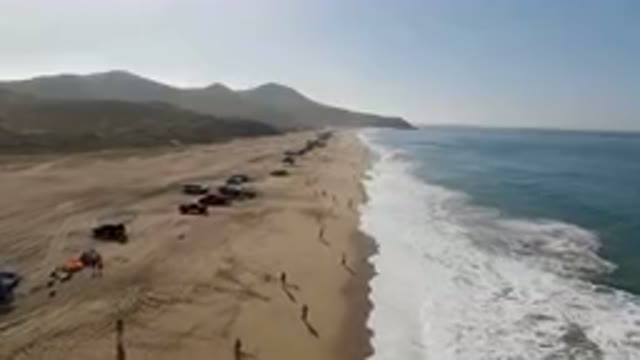 MIGRINO BCS MEXICO-2023: Vehicles Parked On A Beach Next To The Ocean
