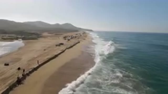 MIGRINO BCS MEXICO-2023: On The Beach With Cars Parked On The Sand