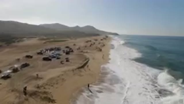 MIGRINO BCS MEXICO-2023: On The Beach With People And Surfboards On The Sand