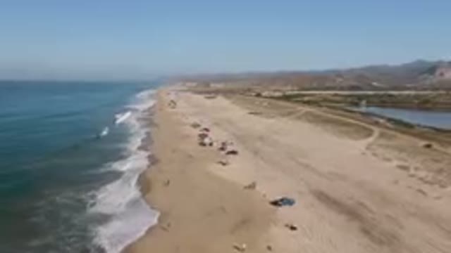 MIGRINO BCS MEXICO-2023: On The Beach With Cars Parked On The Sand