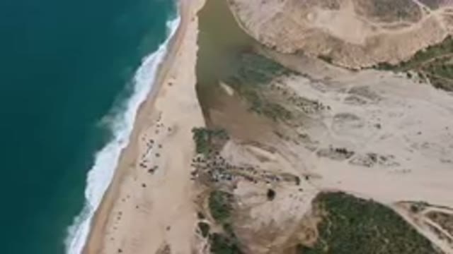 MIGRINO BCS MEXICO-2023: Aerial Beach With A Body Of Water And A Sandy Shoreline