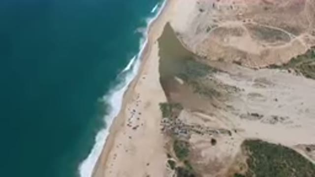 MIGRINO BCS MEXICO-2023: Aerial Beach With A Body Of Water And A Sandy Shoreline