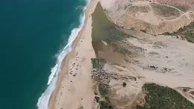 MIGRINO BCS MEXICO-2023: Aerial Beach With A Lot Of People On It