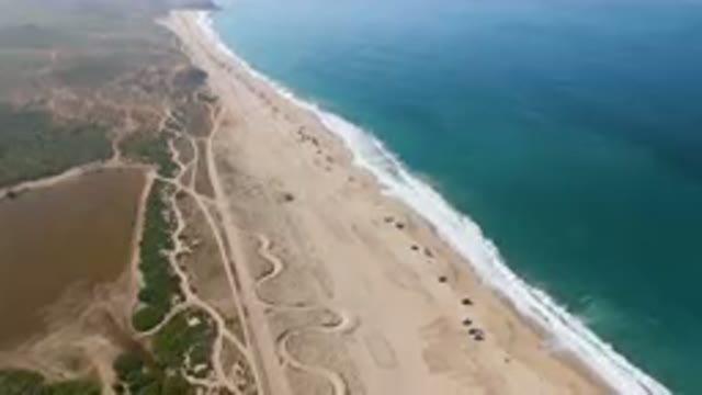 MIGRINO BCS MEXICO-2023: Aerial Beach With A Long Stretch Of Sand And A Body Of Water