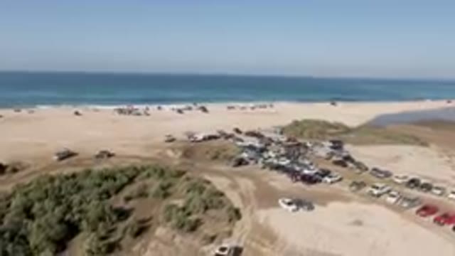 MIGRINO BCS MEXICO-2023: Beach With A Lot Of Cars Parked On It