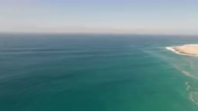 MIGRINO BCS MEXICO-2023: Beach And A Cliff With A Body Of Water