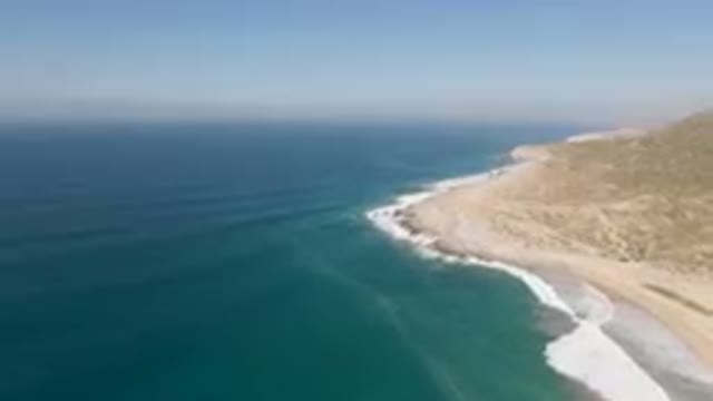 MIGRINO BCS MEXICO-2023: Beach And A Cliff With A Body Of Water