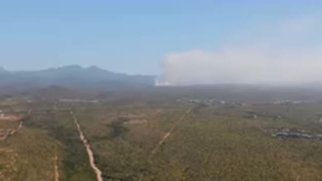 MIGRINO BCS MEXICO-2023: Large Plume Of Smoke Rising From The Mountains
