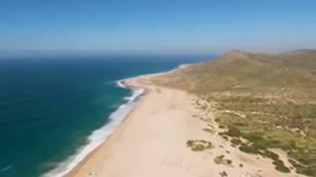 MIGRINO BCS MEXICO-2023: Beach With A Hill In The Background