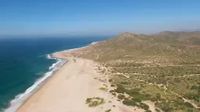 MIGRINO BCS MEXICO-2023: Beach And A Mountain With A Blue Ocean
