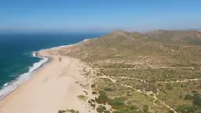 MIGRINO BCS MEXICO-2023: Beach And A Mountain With A Blue Sky