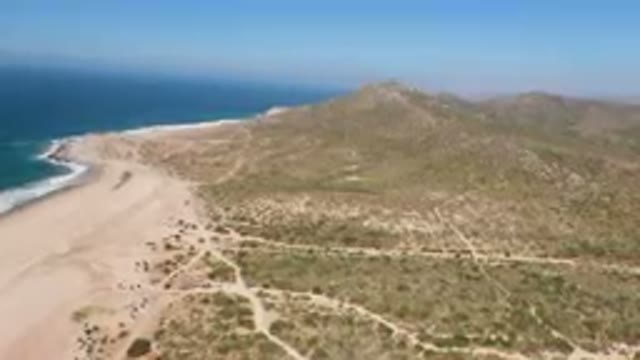 MIGRINO BCS MEXICO-2023: Aerial Beach And Mountain With A Sandy Beach