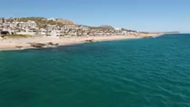 LAGUNA BEACH LOS CABOS BCS MEXICO-2023: Beach With A Lot Of Houses And A Body Of Water