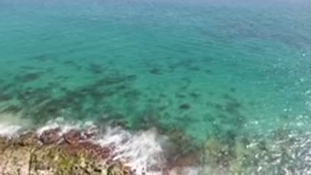 LAGUNA BEACH LOS CABOS BCS MEXICO-2023: Swimming In The Ocean Near A Rocky Shore