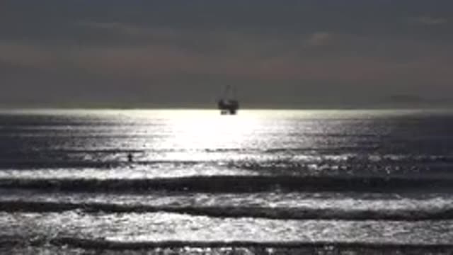 MALIBU CALIFORNIA-2020: Large Boat Setting Anchor on the Horizon in Nearly Empty Waters