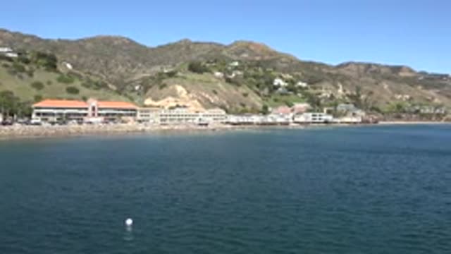 MALIBU CALIFORNIA-2020: A Mountainous Resort Overlooking An Open Sea With Rippling Waves