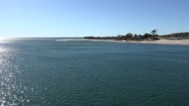 MALIBU CALIFORNIA-2020: Pretty Blue Sky Water Surface Ripples From Current Sandy