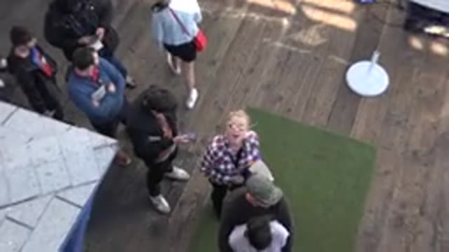 MALIBU CALIFORNIA-2020: A Woman Waving at a Casual Gathering