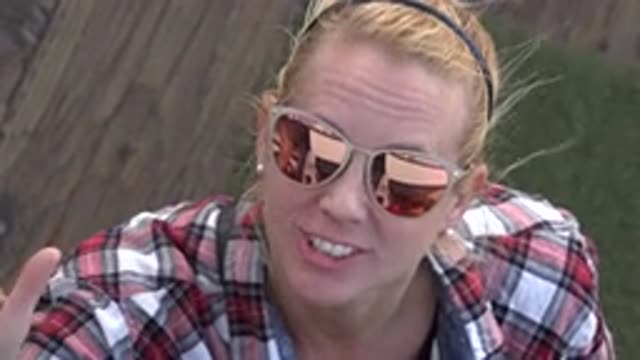 MALIBU CALIFORNIA-2020: Blonde Woman With Sunglasses And Plaid Shirt Sends A Kiss