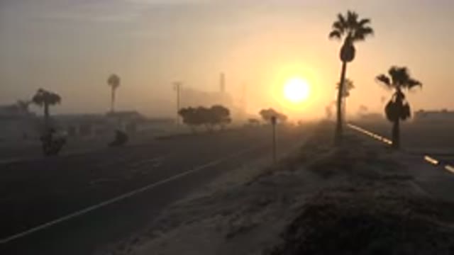 HUNTINGTON BEACH CALIFORNIA-2020: Sunset On Desert Road With Palm Trees