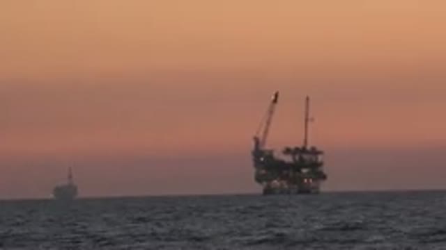 HUNTINGTON BEACH CALIFORNIA-2020: Oil Platform Pumping Oil In The Middle Of A Calm Ocean