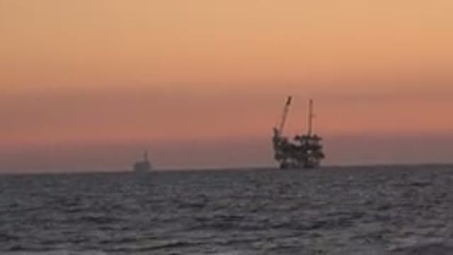 HUNTINGTON BEACH CALIFORNIA-2020: Sunset Sea Ship Background Open Waves Current