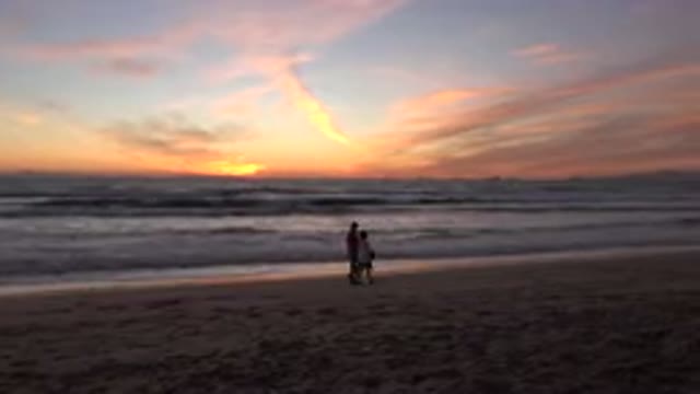 HUNTINGTON BEACH CALIFORNIA-2020: A Couple Is Walking Around At The Sea In The