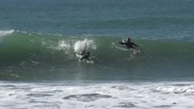 HUNTINGTON BEACH CALIFORNIA-2020: Two Surfers Catch A Really Strong Wave And