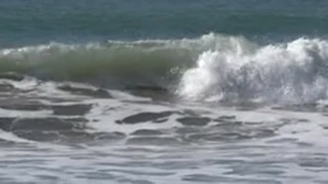 HUNTINGTON BEACH CALIFORNIA-2020: Man Surfing On The Sea Waves