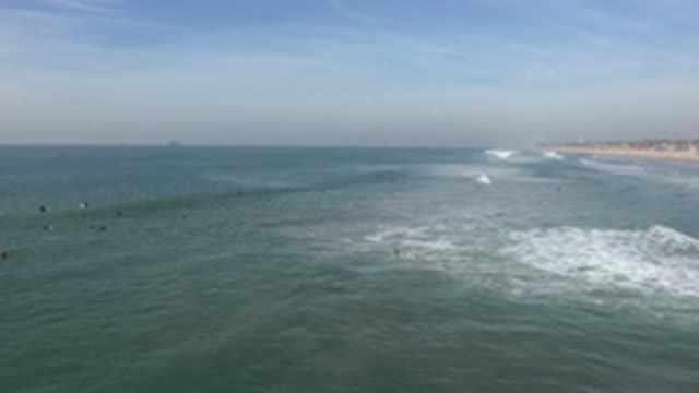 HUNTINGTON BEACH CALIFORNIA-2020: Long View Beach Peoples Swimming Seashore Blue