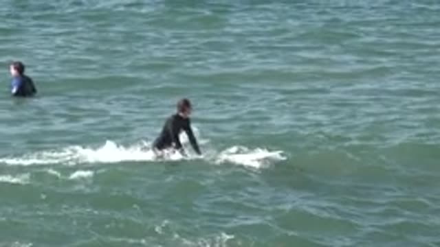 HUNTINGTON BEACH CALIFORNIA-2020: Surfers On The Beach Waiting For Their Perfect Wave