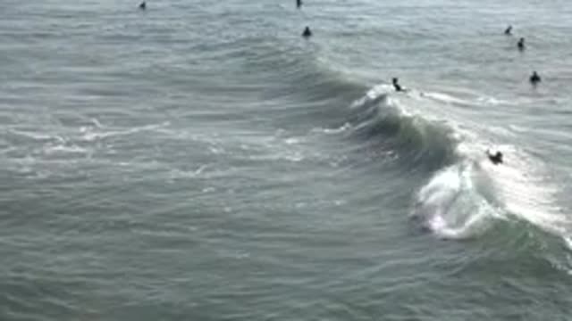 HUNTINGTON BEACH CALIFORNIA-2020: People Swimming In The Beach With Heavy Tides