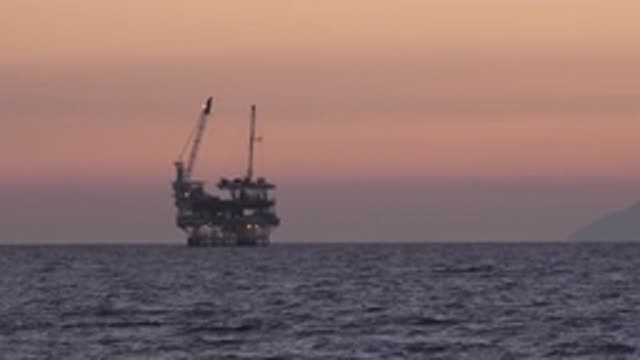 HUNTINGTON BEACH CALIFORNIA-2020: Oil Platform Shooting During The Sunset Over